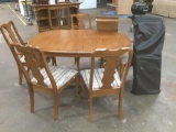 Solid oak dining set with cabriolet legs five chairs , 2 extensions, and protective pads with cover