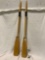 Pair of wood row boat oars with metal mounts, approx 5 x 59 in.