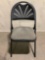 Sudden Comfort folding chair with upholstered seat and plastic back. INV 2212