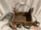 Antique wood crate with collection of eight vintage oil cans / gas can.