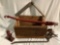 Antique wood crate with collection of metal tools, Jack, crowbar, and more.