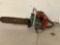 Large vintage HOMELITE model 17 gas powered chain saw, shows wear, sold as is