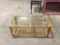 Vintage bamboo coffee table w/ glass top, approx 54 x 24 x 18 in.