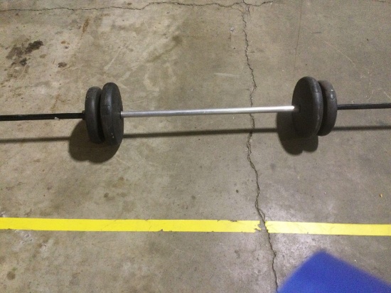 Barbell with weights Approximately 62 pounds of weights plus barbell