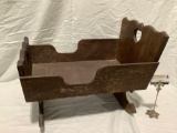 Antique wooden baby cradle rocker, approximately 22 x 17 x 14 in.
