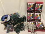 Collection of gently used strings of Christmas lights, some in box, many styles.