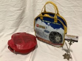 2 pc. auto lot; Les Schwab Quick fit sport LT tire chains in vinyl bag, + car and driver booster