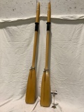 Pair of wood row boat oars with metal mounts, approx 5 x 59 in.