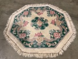 Vintage octagonal wool rug with fringe, approximately 39 in.