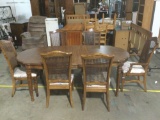 Dining table with two leaf extensions and six chairs in good condition