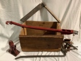 Antique wood crate with collection of metal tools, Jack, crowbar, and more.