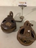 2 pc. Lot of rusty antique metal pulleys; Young 708 - Seattle, Lamb, approx 12 x 6 x 4 in.