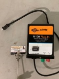 Gallagher M100 plug-in electric fence energizer, approx 6 x 7 x 4 in. Sold as is.