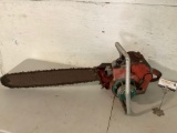 Large vintage HOMELITE gas powered chain saw, shows wear, sold as is