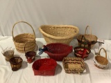 11 pc. lot of vintage woven baskets w/ decorative trim, approx 24 x 18 x 11 in.