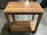 Modern pressboard wood table, approx 28 x 18 x 28 in.
