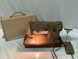 Vintage SINGER sewing machine, tested and powers on, approx 17 x 8 x 16 in.