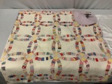 Vintage multi-color patchwork quilt w/ geometric design. Approx. 84 x 88 in.