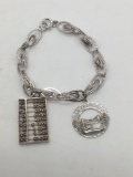 Very cute sterling silver charms bracelet with 2 sterling charms