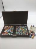 Collection of machine mades marbles in a wooden presentation box see pics