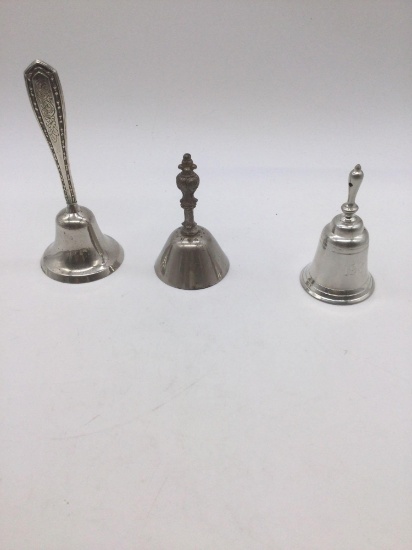 Collection of 3 bells one is sterling handle , antique german desk, and one 1989 pewter