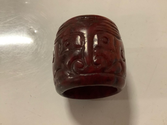 Fine old red colored Chinese carved stone/jade thumb ring with monster face designs
