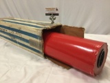 Vintage industrial size rolls of red Christmas gift wrapping paper