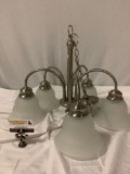 Hanging light fixture with five lamps and frosted glass shades, approx 22 x 18 in.