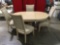 Pedestal dining table w/ 4 upholstered chairs