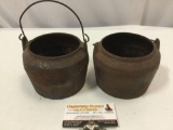 2 antique cast iron pots w/ handle, 1 marked; Marietta PA , approx 6 x 4 in.