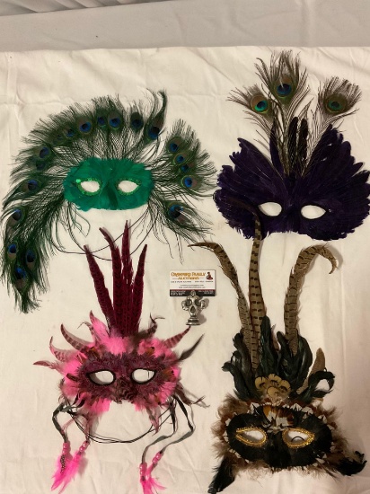 4 pc. Lot of peacock feather masks.