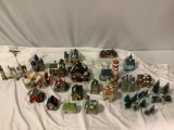 Lg. collection of vintage painted ceramic lighted Christmas village pieces w/ trees, lights, tiny