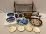 Mixed lot of vintage decor; tin bowl, plates, seashell servers, Octoberfest mug, wood rack & more.