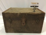 Antique wood canvas wrapped trunk with leather handles and metal hardware, as is