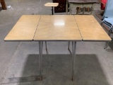 mid century drop-leaf wood laminate/ chrome kitchen table, approx 47 x 30 x 29 in.