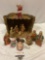 Vintage nativity scene holiday decorations with wooden manger and painted ceramic / resin figures.