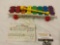 Vintage 1978 Fisher Price Toys XYLOPHONE with music sheet, approx 14 x 5 x 2 in.