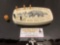 Vintage scrimshaw cribbage set w/ fishing bear image & 5 pegs, approx 7 x 4 x 1 in.