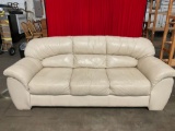 Gently used cream colored leather couch