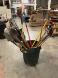Over 20 pc. lot of yard tools; wood handle shovels, pitchforks, rakes, snow shovel, hoe and more.