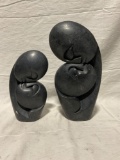 Pair of different sized Hand Carved African Stone sculptures of resting lovers signed by same artist