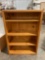 Vintage pinewood adjustable bookshelf w/ 4 shelves, approx 32 x 12 x 48 in. Shows wear.