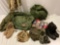 US military canvas bags stuffed full of camouflage uniform pieces, flight suit, gas mask, briefs in