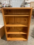 Vintage pinewood adjustable bookshelf w/ 4 shelves, approx 32 x 12 x 48 in. Shows wear.