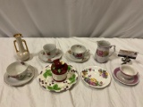 Lot of tea cups & saucers, apple candle, bud vase, see pics.