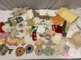 Large collection of vintage knit pot holders, handkerchiefs, table linens & more.