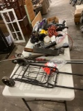 Table full of miscellaneous items, Car vacs , truck hitches , tote Carrier plus
