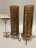 Nice pair of metal votive candle holders. Great condition with slight patina on bases.