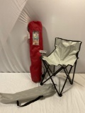 2 pc. Lot of collapsible camp chairs, Canada Day arm chair, larger red chair shows more wear. Sold