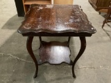 Antique wood table, shows finish wear, approx 24 x 24 x 29 in.